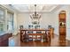 Formal dining room with chandelier and hardwood floors at 14015 Helen Benson Blvd, Davidson, NC 28036