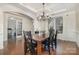 Elegant dining room with chandelier and hardwood floors at 14015 Helen Benson Blvd, Davidson, NC 28036