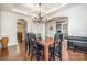 Formal dining room features hardwood floors and a chandelier at 14015 Helen Benson Blvd, Davidson, NC 28036