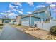Two-story home with attached garage and landscaped backyard, featuring a white vinyl fence at 14015 Helen Benson Blvd, Davidson, NC 28036