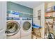 Laundry room with washer, dryer, and shelving at 14015 Helen Benson Blvd, Davidson, NC 28036