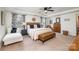 Bright bedroom with plush bed and a cozy seating area at 14015 Helen Benson Blvd, Davidson, NC 28036
