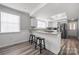 Kitchen with bar counter seating overlooking sink and stainless steel appliances at 152 Eastcliff Se Dr, Concord, NC 28025