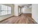 Open living area with large windows and wood-look floors at 1983 Trace Creek Dr, Waxhaw, NC 28173