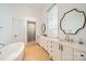 Modern bathroom with double vanity and soaking tub at 2624 Providence Rd, Charlotte, NC 28211