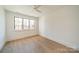 Bright bedroom with hardwood floors and large window at 2624 Providence Rd, Charlotte, NC 28211