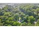 House nestled in a wooded neighborhood at 2830 Royston Rd, Charlotte, NC 28208
