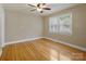 Bright bedroom with hardwood floors and ceiling fan at 2830 Royston Rd, Charlotte, NC 28208