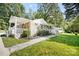 Charming stone and shingle ranch home with a flagstone walkway at 2830 Royston Rd, Charlotte, NC 28208