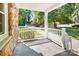 Spacious front porch with white railings and stone floor at 2830 Royston Rd, Charlotte, NC 28208