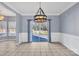 Dining room with a chandelier, sliding glass doors to deck, and tile flooring at 2842 Emerald Meadow Ln, Charlotte, NC 28273