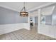 Dining room with chandelier and view into living room at 2842 Emerald Meadow Ln, Charlotte, NC 28273