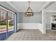 Dining room with chandelier and view of backyard deck at 2842 Emerald Meadow Ln, Charlotte, NC 28273