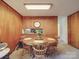 Dining room with wood paneled walls and round wooden table at 2918 Imperial Dr, Gastonia, NC 28054