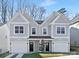 Two story duplex with gray siding, two-car garages, and landscaping at 3114 Amay James Ave, Charlotte, NC 28208