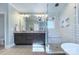 Elegant bathroom with double vanity, soaking tub, and walk-in shower at 3123 Windsor Dr, Charlotte, NC 28209