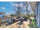 Outdoor deck features a seating area and string lights at 3123 Windsor Dr, Charlotte, NC 28209