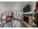 Stone fireplace with mantle, flanked by built-in shelving at 3215 Osceola Ln, Charlotte, NC 28269