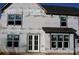 Rear view of house under construction, featuring double doors at 3215 Player Ct, Salisbury, NC 28144
