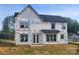 Two-story home under construction featuring a covered porch, black roof, and white window trim at 3215 Player Ct, Salisbury, NC 28144