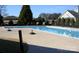 L-shaped community pool with surrounding landscaping at 3215 Player Ct, Salisbury, NC 28144