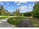 Community features a walking path, a pond, and a sand volleyball court at 413 Serenity Cir, Cramerton, NC 28032