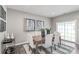 Bright dining room with hardwood floors, a wooden table, and access to a back patio at 413 Serenity Cir, Cramerton, NC 28032