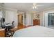 Bedroom with hardwood floors, queen bed, and en-suite bathroom at 4918 Addison Dr, Charlotte, NC 28211