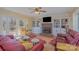 Cozy living room with brick fireplace, built-in shelving, and french doors at 4918 Addison Dr, Charlotte, NC 28211