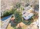Aerial view of a white house with a yard and black fence at 711 Concord Rd, Davidson, NC 28036