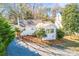 Aerial view of a white house with a yard and black fence at 711 Concord Rd, Davidson, NC 28036