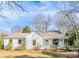 Charming white home featuring a light blue front door and inviting front porch at 711 Concord Rd, Davidson, NC 28036