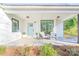 Inviting front porch with seating area and a light blue front door at 711 Concord Rd, Davidson, NC 28036