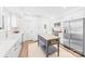 Modern kitchen with white cabinets, stainless steel appliances and a kitchen island at 711 Concord Rd, Davidson, NC 28036