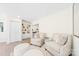 Cozy living room with two armchairs, built in shelving, and hardwood floors at 711 Concord Rd, Davidson, NC 28036