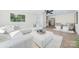 Open concept living room with sectional sofa, ottoman and hardwood floors at 711 Concord Rd, Davidson, NC 28036