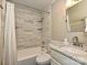 Clean bathroom, marble tile and updated fixtures at 718 Lochridge Rd, Charlotte, NC 28209