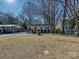 House with a red door and driveway, surrounded by trees at 718 Lochridge Rd, Charlotte, NC 28209