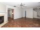 Open living room with hardwood floors and access to kitchen at 7225 Sandown Ct # 96, Harrisburg, NC 28075