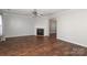 Living room with hardwood floors and fireplace at 7225 Sandown Ct # 96, Harrisburg, NC 28075