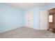 Light blue bedroom with double doors closet and carpet flooring at 7225 Sandown Ct, Harrisburg, NC 28075