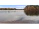 Serene lakefront view with fall foliage at 940 Jetton St # 13, Davidson, NC 28036