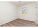 Bedroom featuring wood-look floors, neutral paint, and a bright window at 108 Robinson Dr, Cherryville, NC 28021