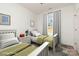 Bright bedroom with twin beds, natural light, and neutral decor, creating a cozy and inviting space at 108 Robinson Dr, Cherryville, NC 28021