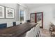 Elegant dining room with a large wooden table, white chairs, and natural light from a window and glass door at 108 Robinson Dr, Cherryville, NC 28021