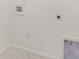 Laundry hookups are in this clean, neutral room with tile floors and white trim at 108 Robinson Dr, Cherryville, NC 28021