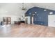 Open-concept living area with modern kitchen, wood floors, high ceilings, and abundant natural light at 108 Robinson Dr, Cherryville, NC 28021