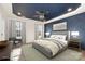 Comfortable bedroom with a king bed, stylish ceiling design, with recessed lights and large windows at 108 Robinson Dr, Cherryville, NC 28021
