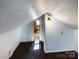 Unfinished attic space with window and potential for conversion at 117 Mardon Ln, Statesville, NC 28677