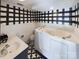 Walk-in bathtub with black and white patterned floor at 117 Mardon Ln, Statesville, NC 28677